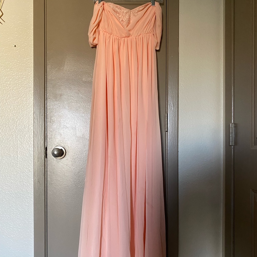 Peach color gown with off the shoulder sleeves and lace in the middle